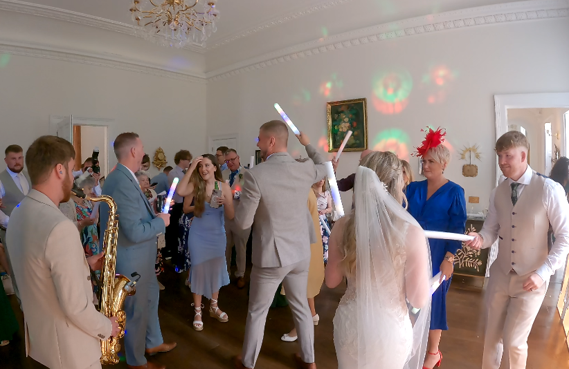 DJ and saxophone performance at an event