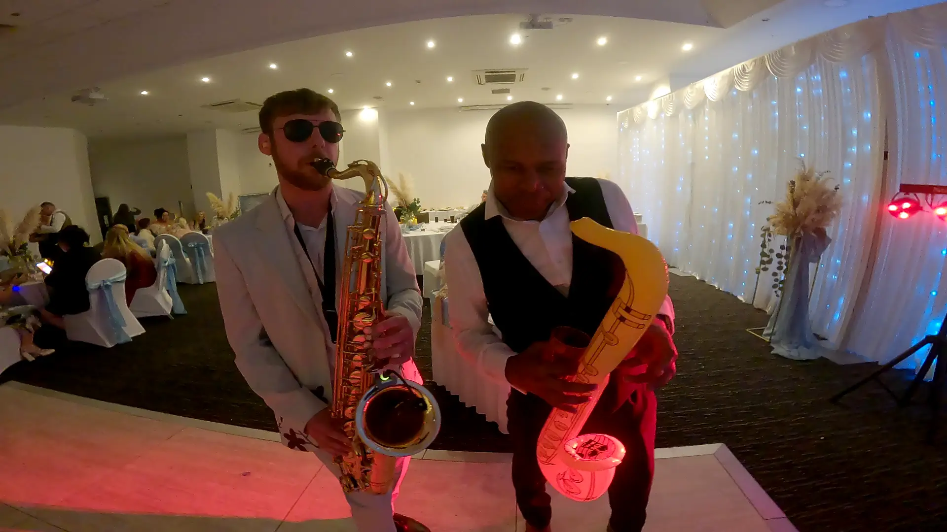 DJ and saxophone performance at an event